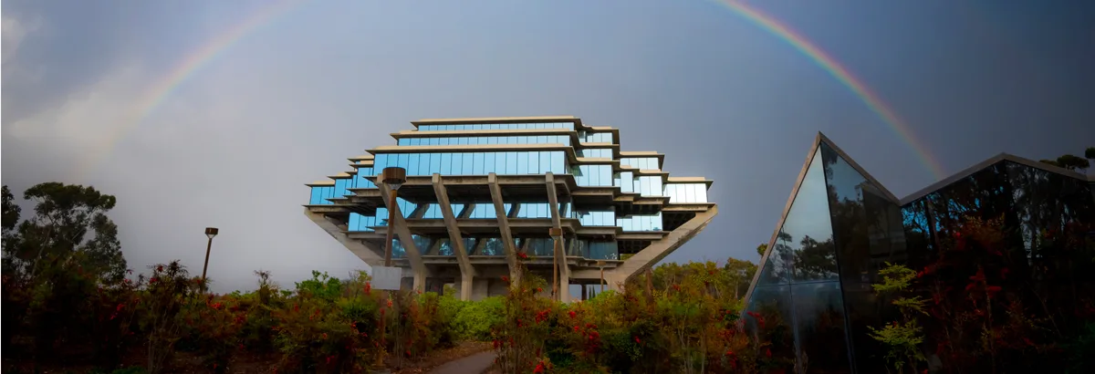 Geisel Library beneath a rainbow over the UC San Diego campus